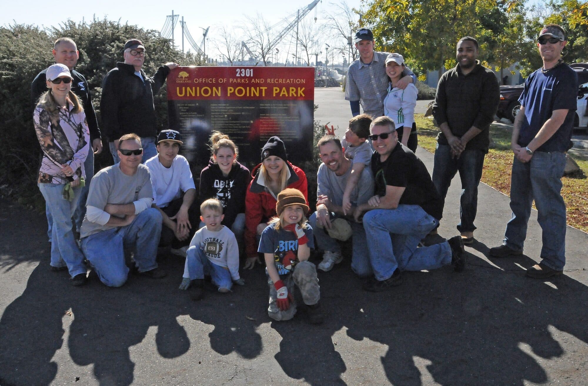 Volunteers of different ages gathered after a cleanup at Union Point Park in Oakland